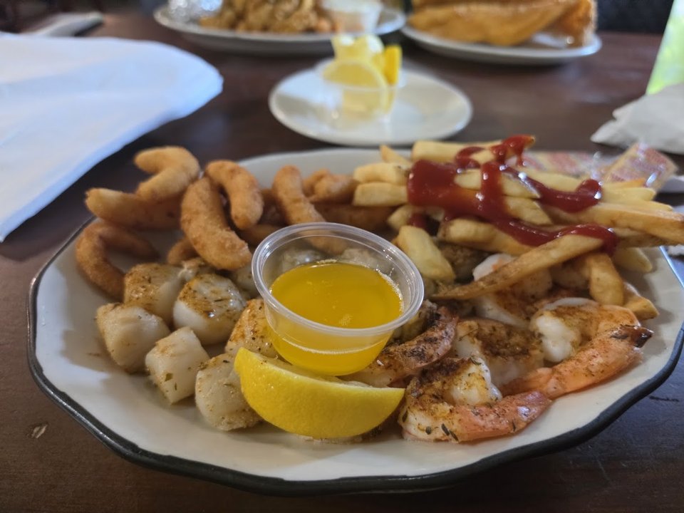 Broiled fish served with classic sides.